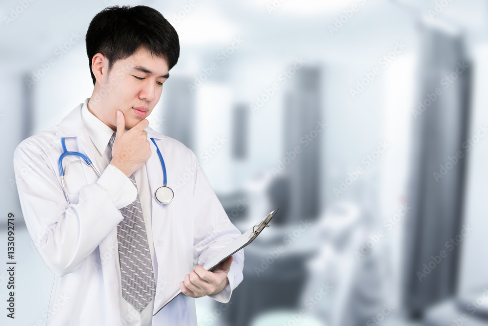 Portrait of Asian doctor holding file patient chart