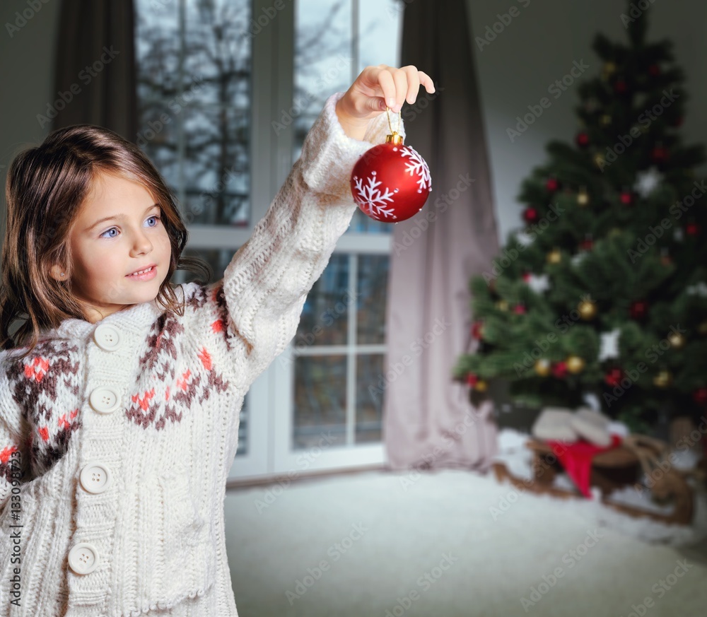 Little girl decorating.