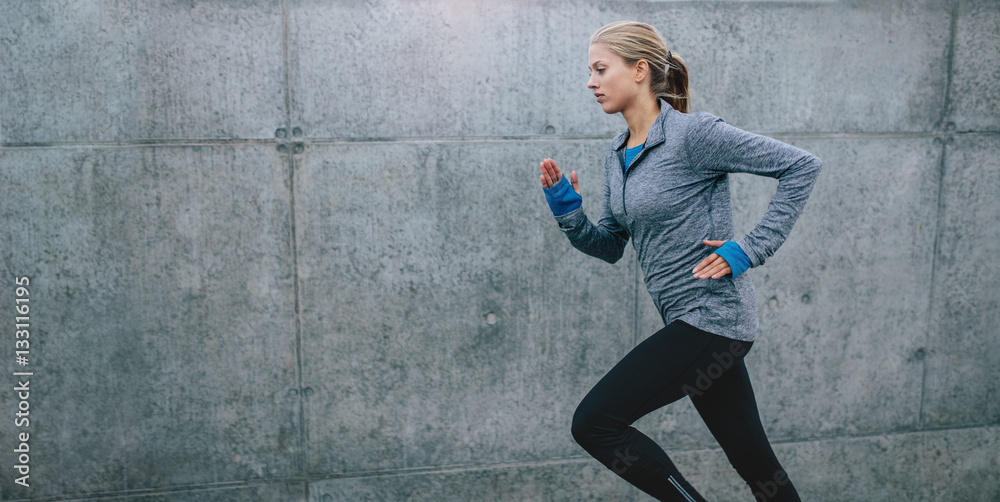 Healthy young woman jogging in morning