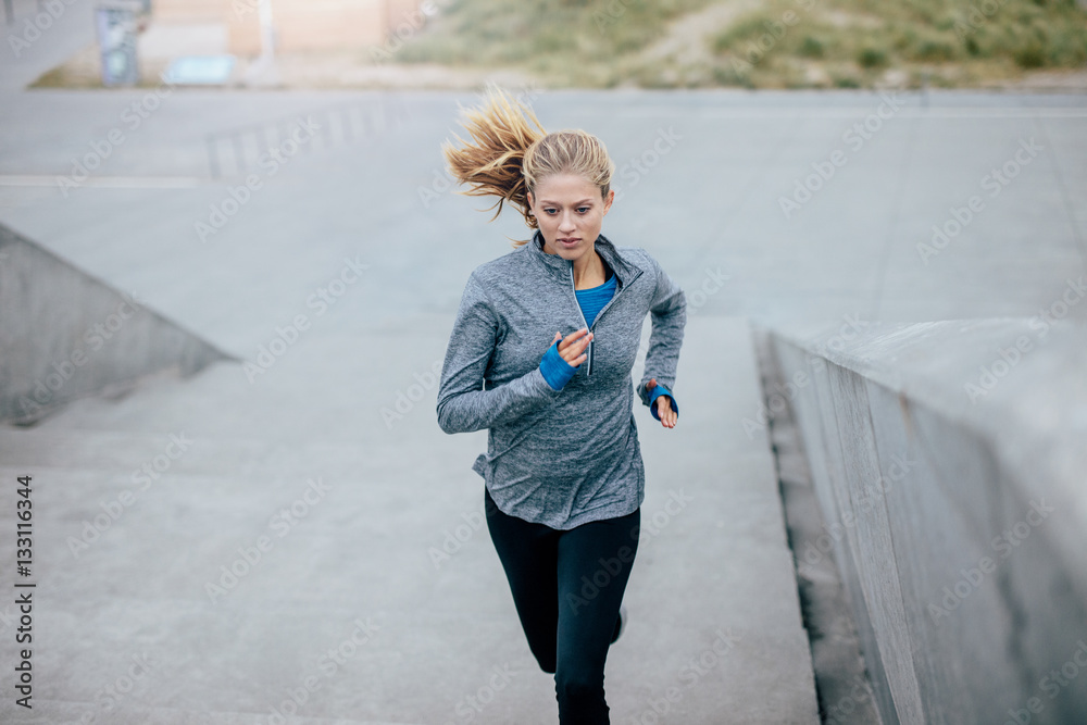 Fitness female exercising in morning