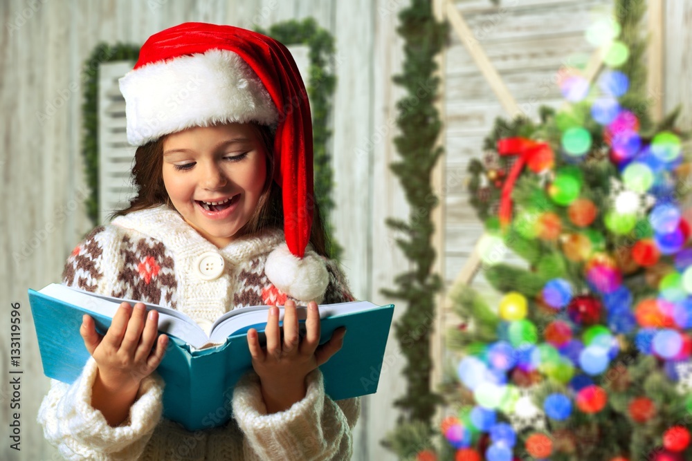 Surprised child opening book.