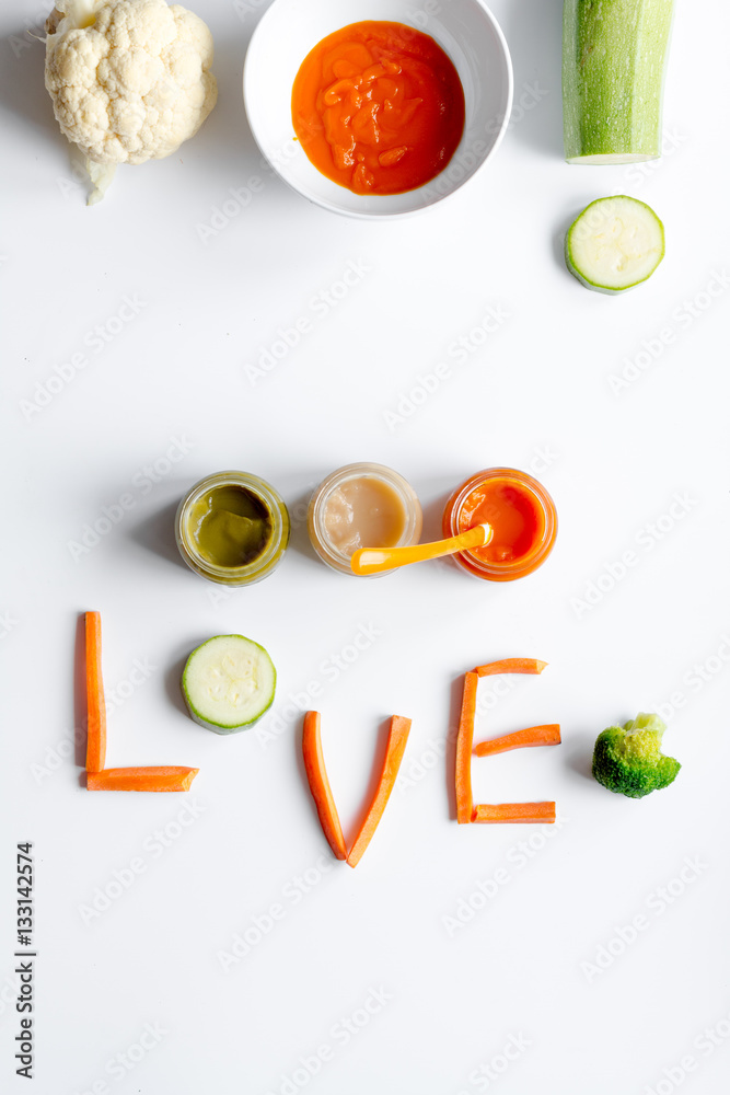 cooking vegetable puree for baby on white background top view