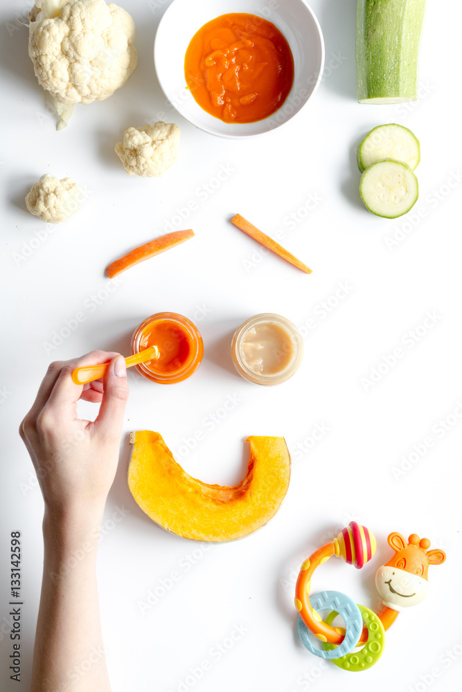 cooking vegetable puree for baby on white background top view