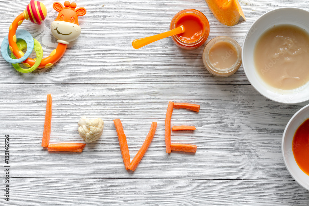 baby vegetable puree on wooden background top view