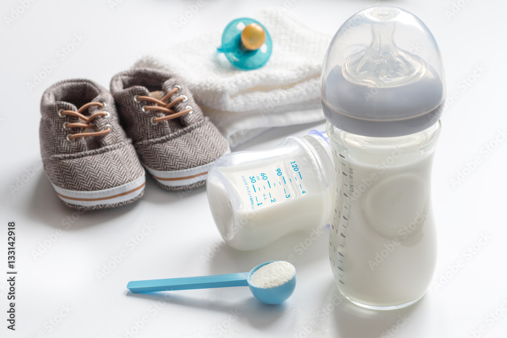 preparation of mixture baby feeding on white background