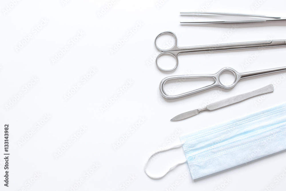 instruments for plastic surgery on white background top view