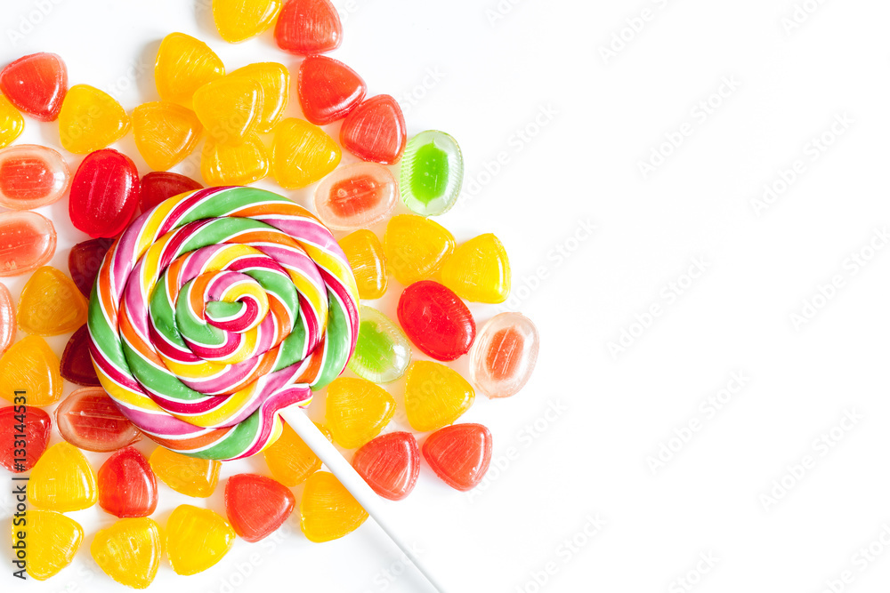 sweets and sugar candies on white background top view