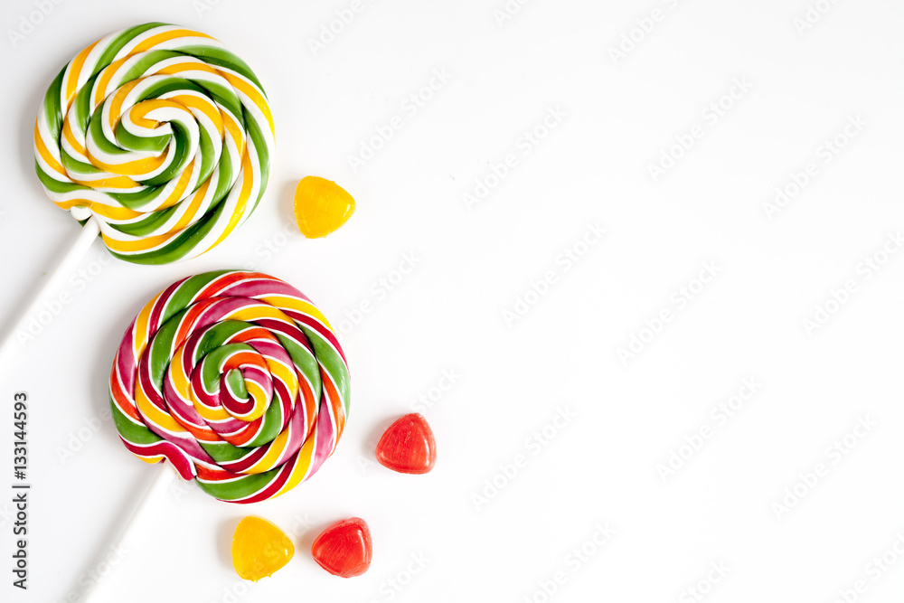 sweets and sugar candies on white background top view