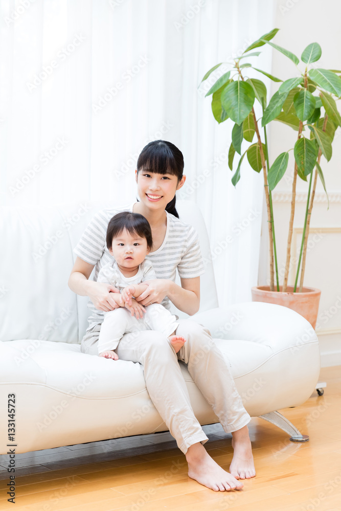 portrait of asian baby and mother relaxing