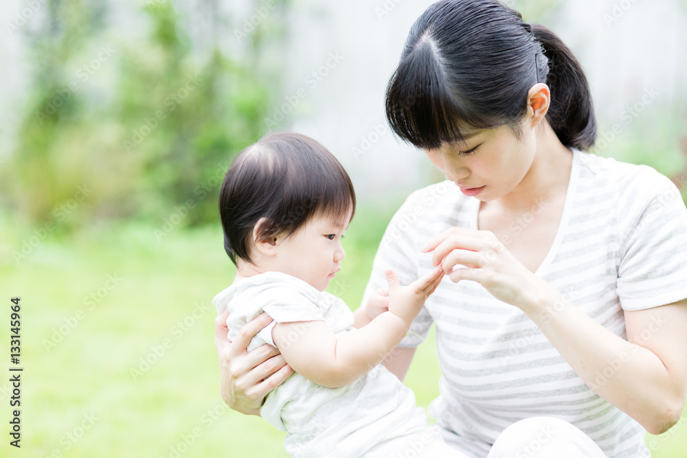 portrait of asian baby and mother relaxing