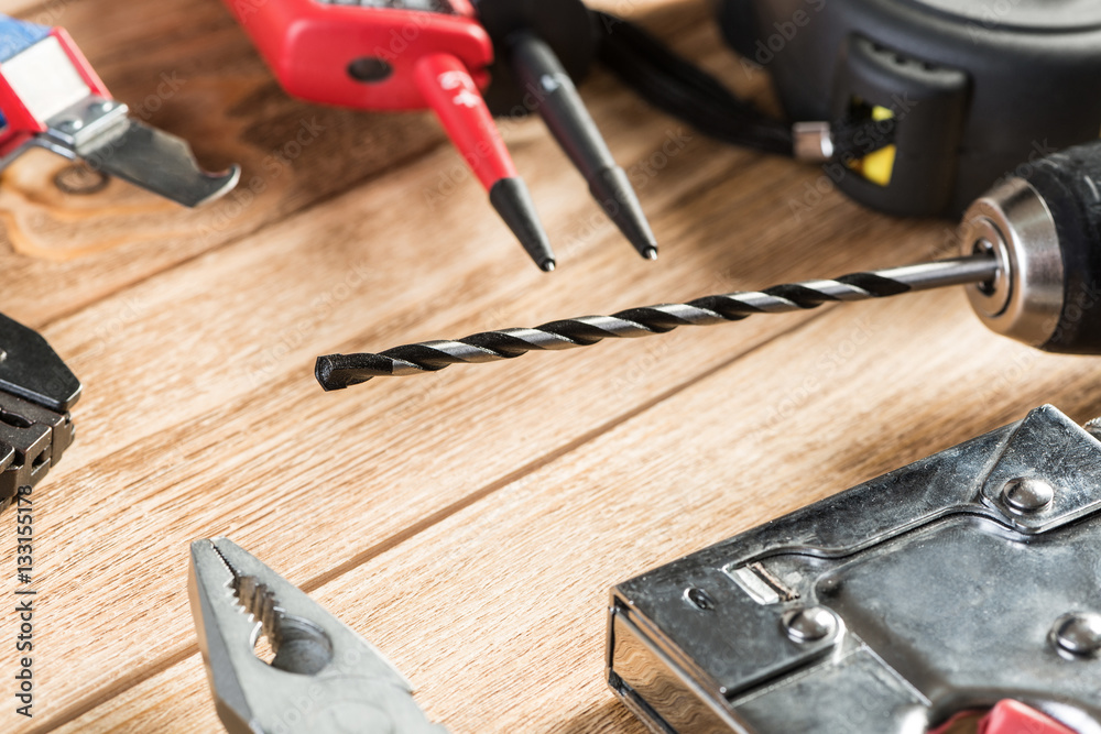 Carpentry tools on wooden surface