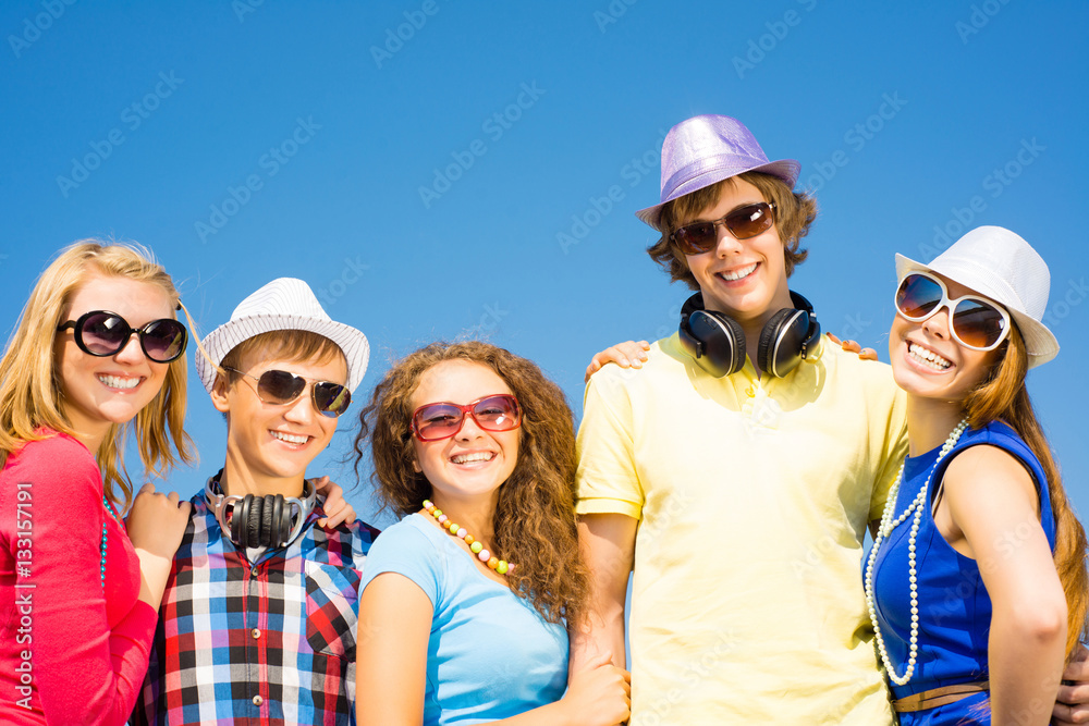 group of young people wearing sunglasses and hat