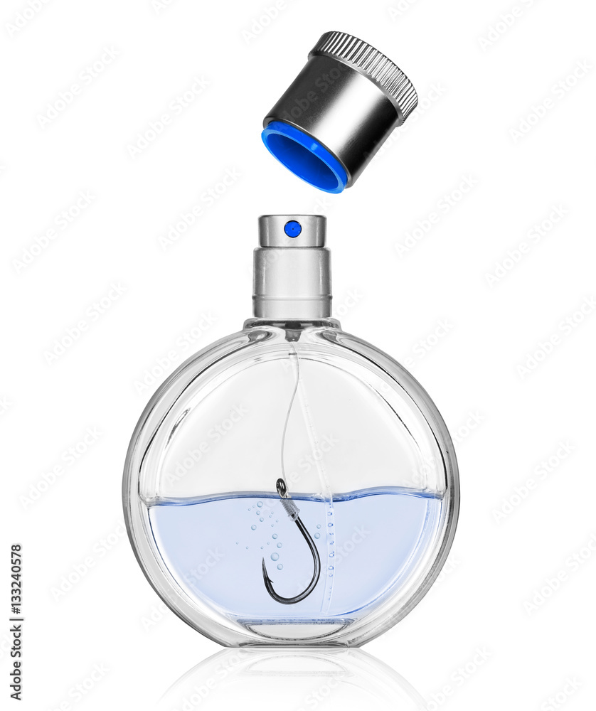 Perfume bottle with a fishing hook inside. Concept photo.