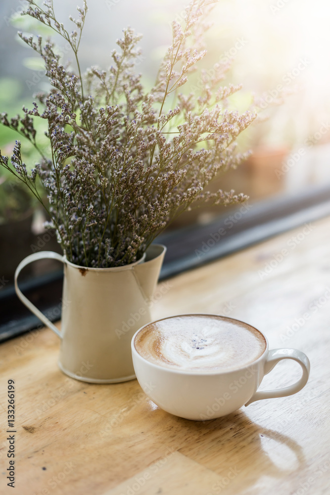 Cup of Latte in coffee shop background