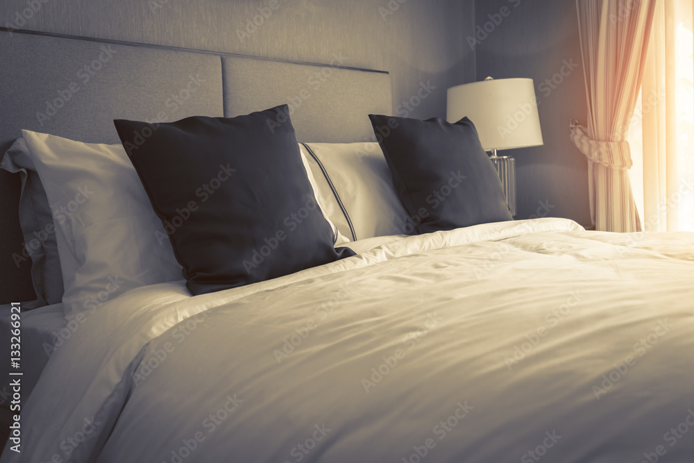 Bed maid-up with clean white pillows and bed sheets in beauty ro