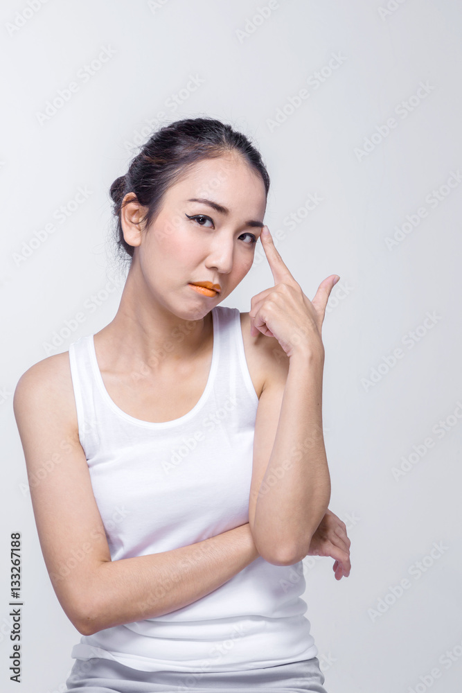 Beautiful young asian woman thinking on white background