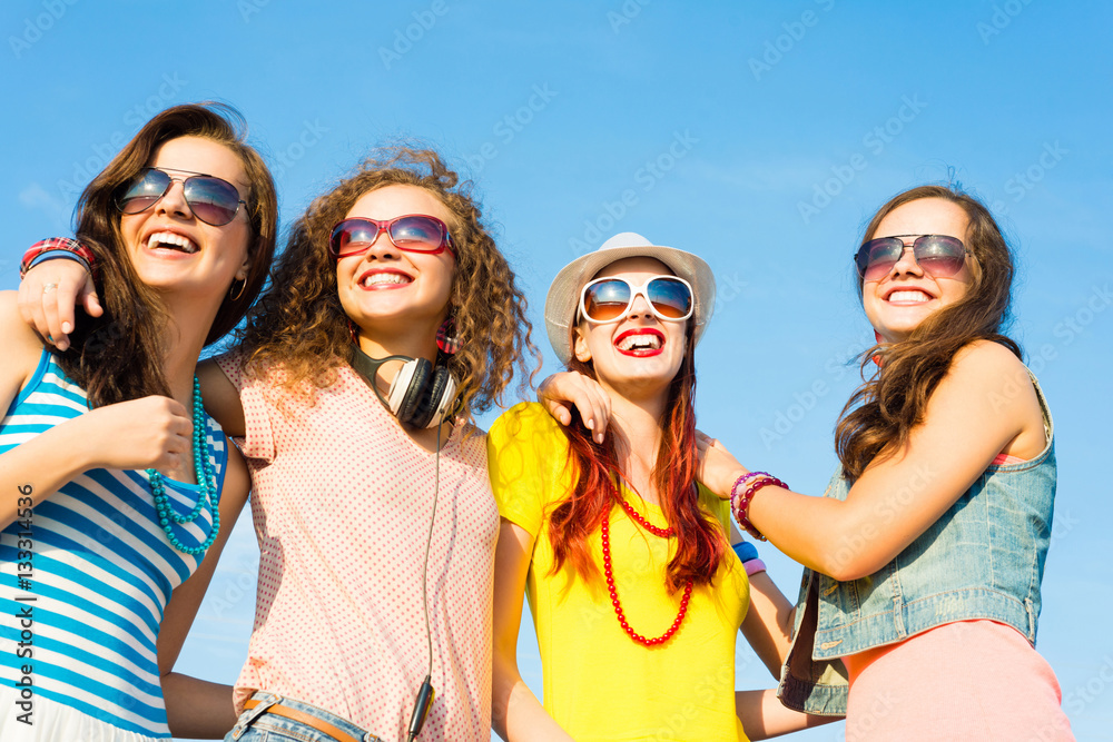 group of young people wearing sunglasses and hat