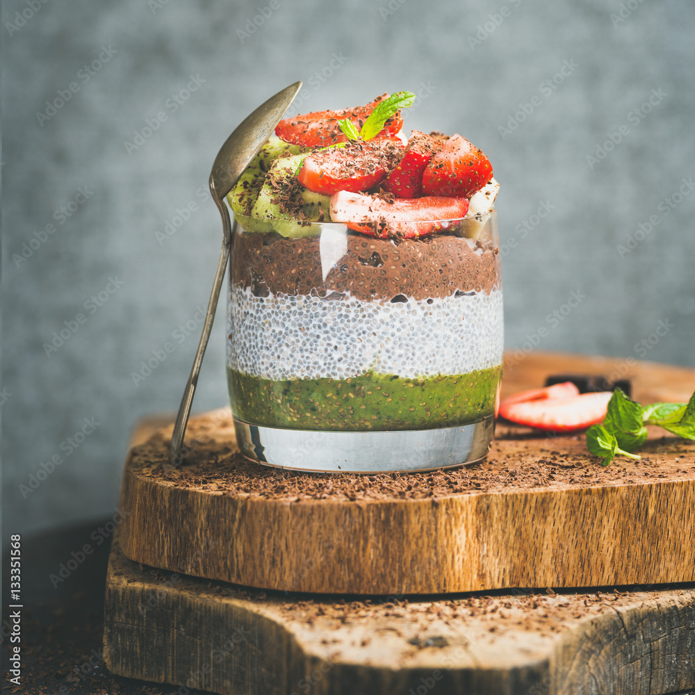 Healthy breakfast. Matcha, almond milk, cocoa chia seed pudding with fresh fruit, berries, mint, cho