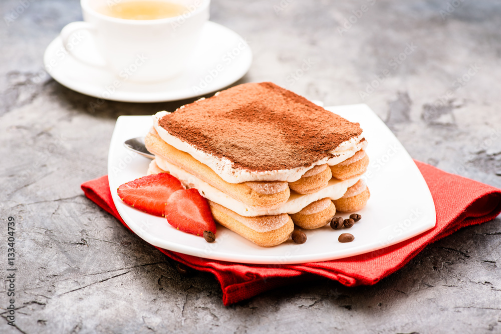 Tiramisu with strawberry on the table. Tea time