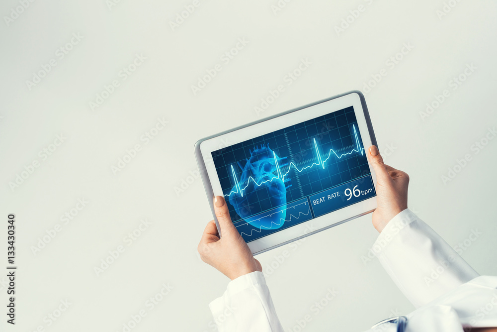 Close of female doctor hands working with tablet pc computer