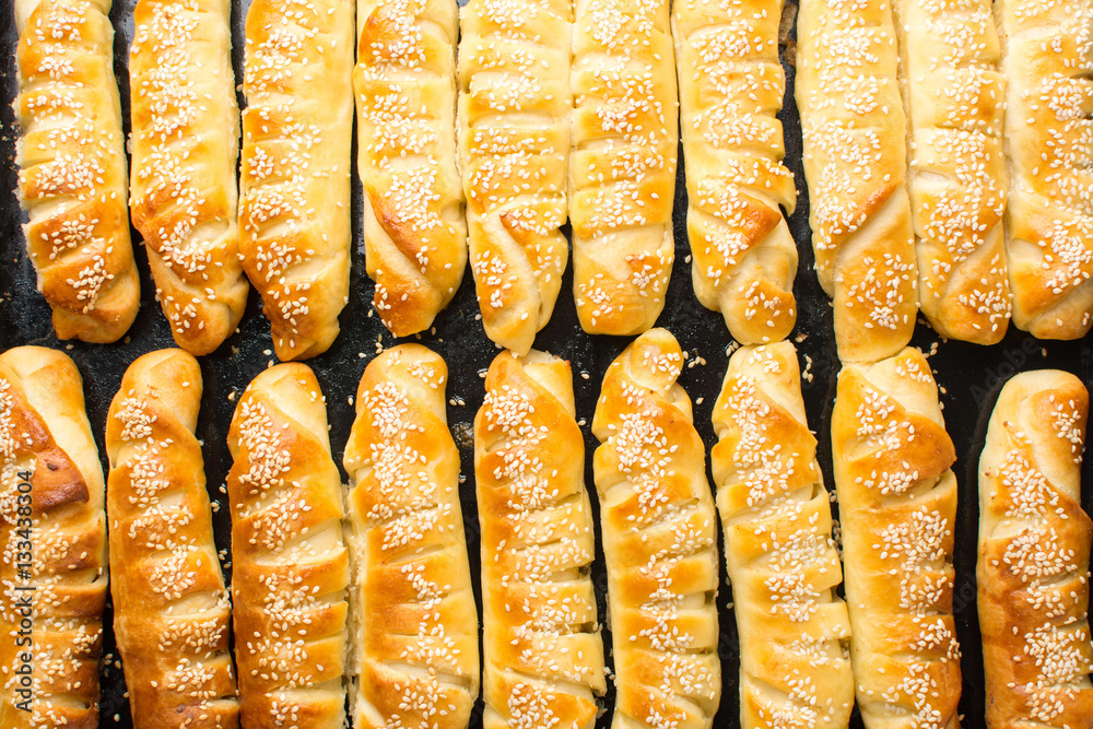 Homemade pastry on black baking pan