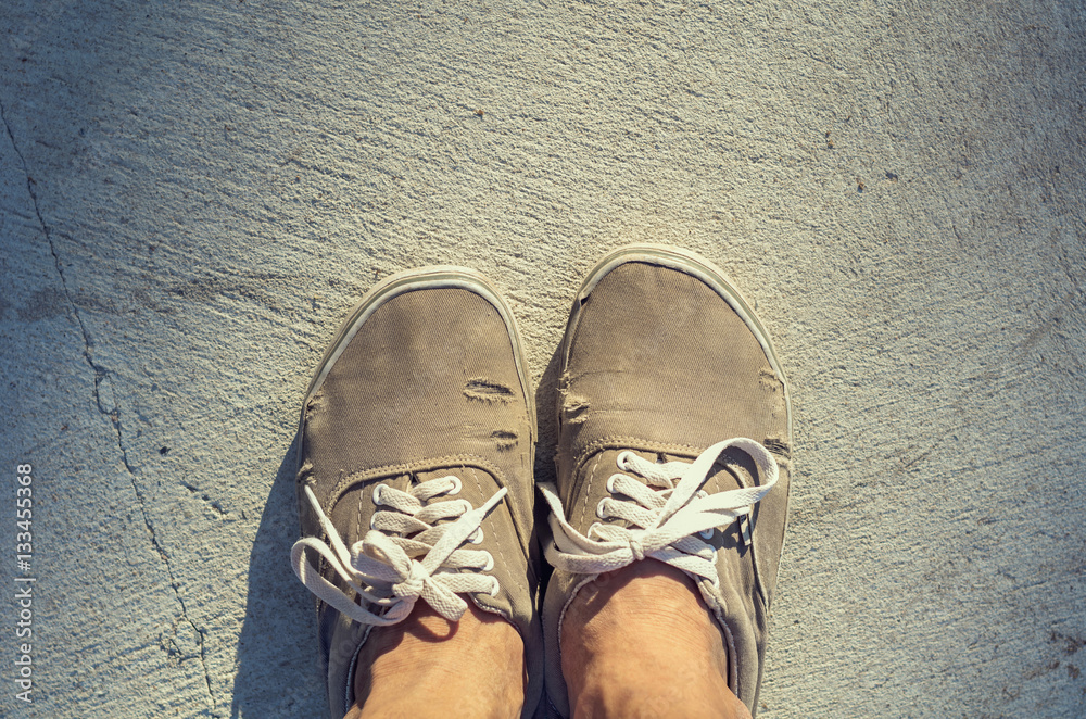 Old brown shoes on cement floor