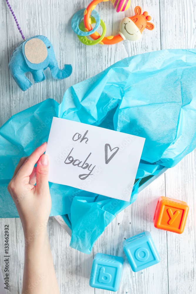 birth of boy - baby shower concept on wooden background