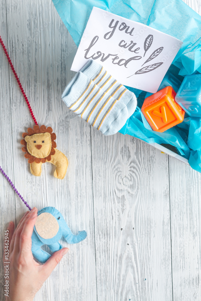 birth of boy - baby shower concept on wooden background