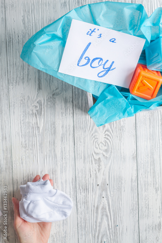 birth of boy - baby shower concept on wooden background