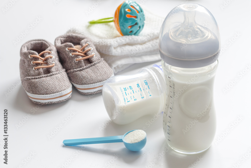 preparation of mixture baby feeding on white background