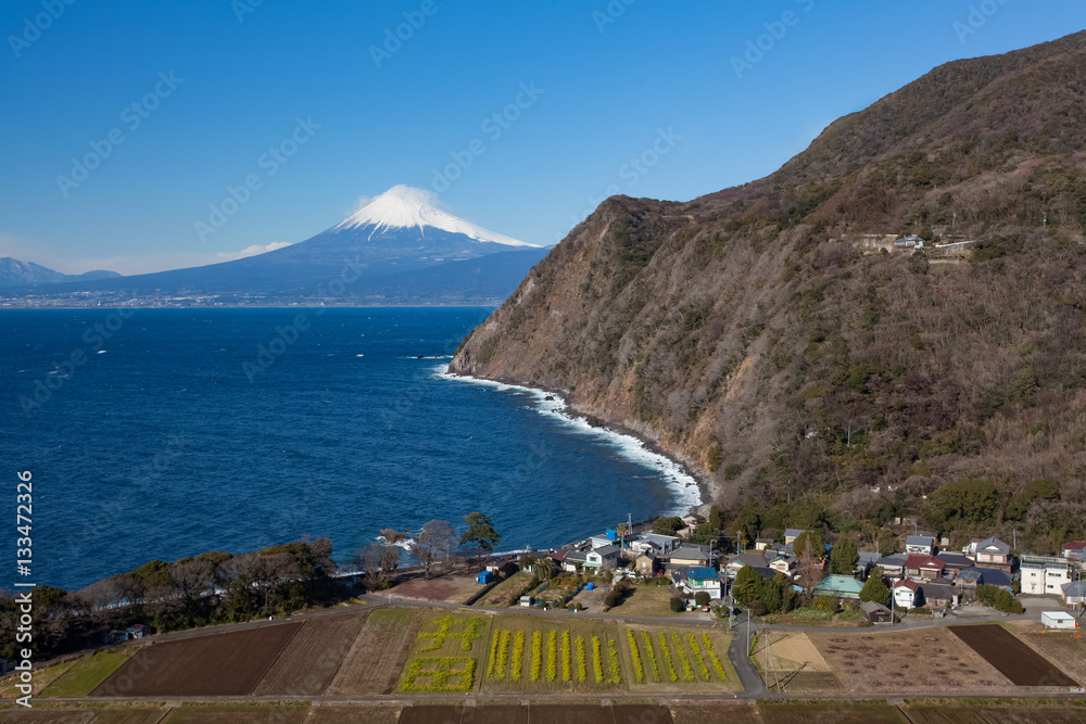 Mountain fuji and Japan sea in winter seen from Izu city , Shizuoka prefecture