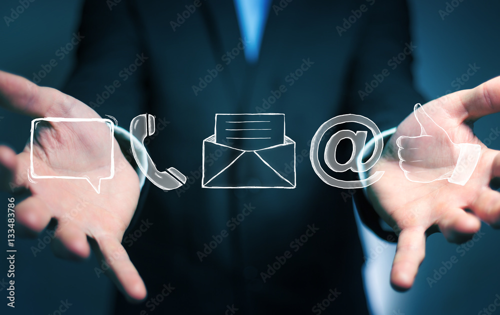 Businessman holding manuscript contact icon in his hand