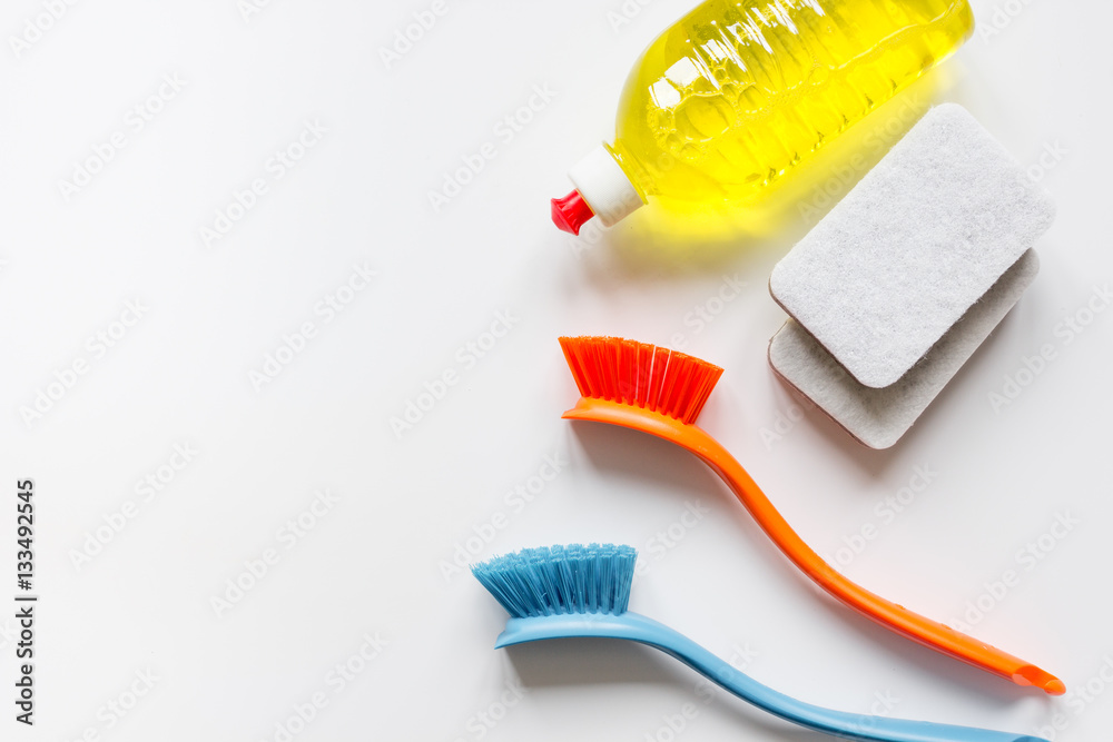 concept of washing dishes on white background top view