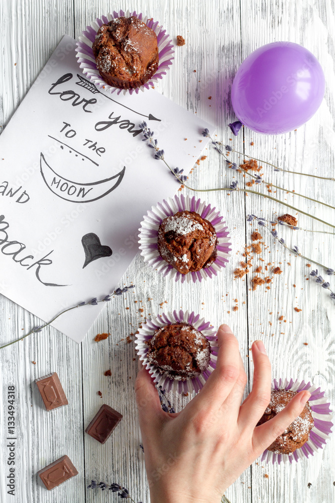 concept of Valentines Day cupcakes wooden background top view