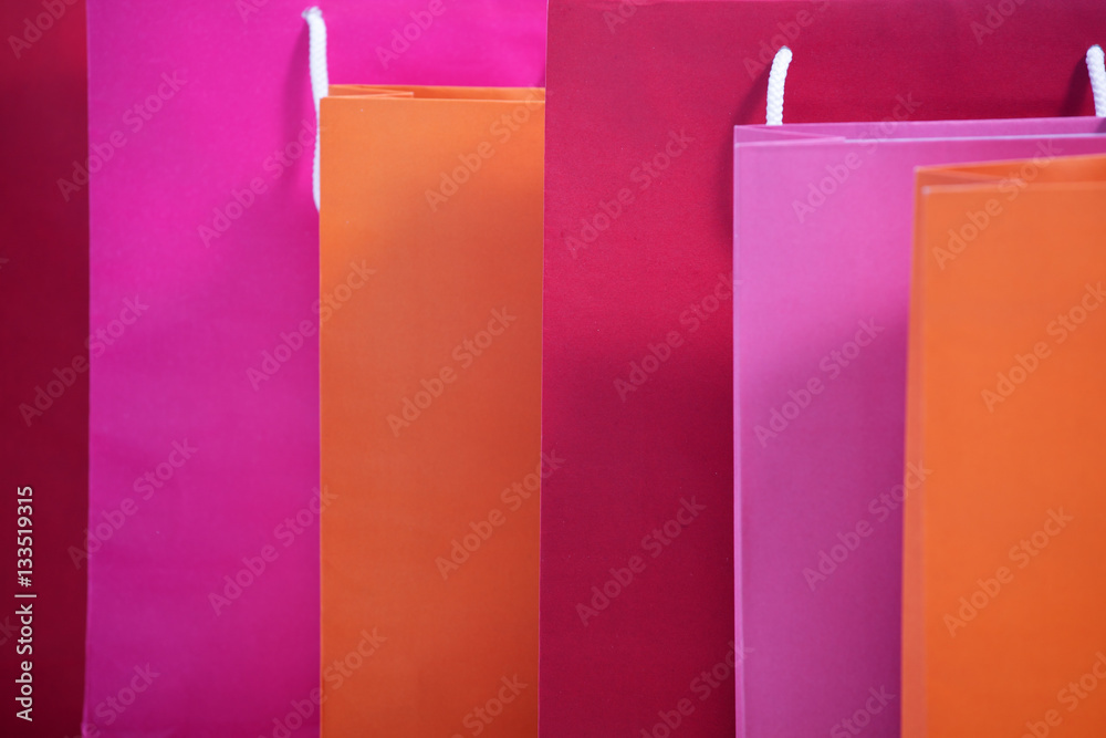 Shopping colorful sale paper bags close-up as background