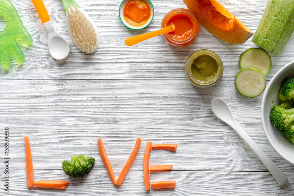 baby vegetable puree on wooden background top view