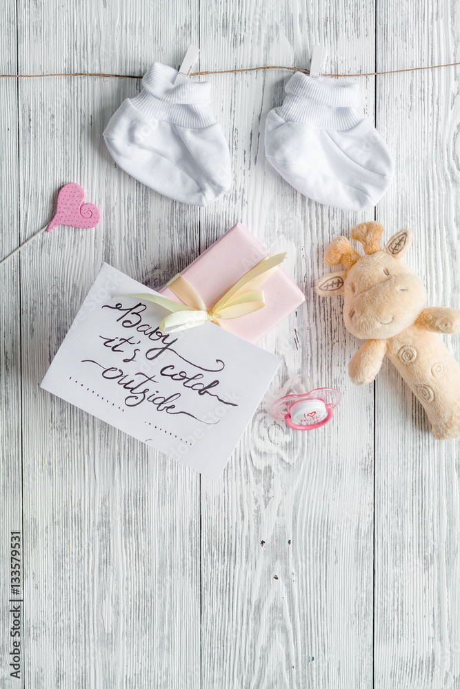 birth of child - baby shower concept on wooden background