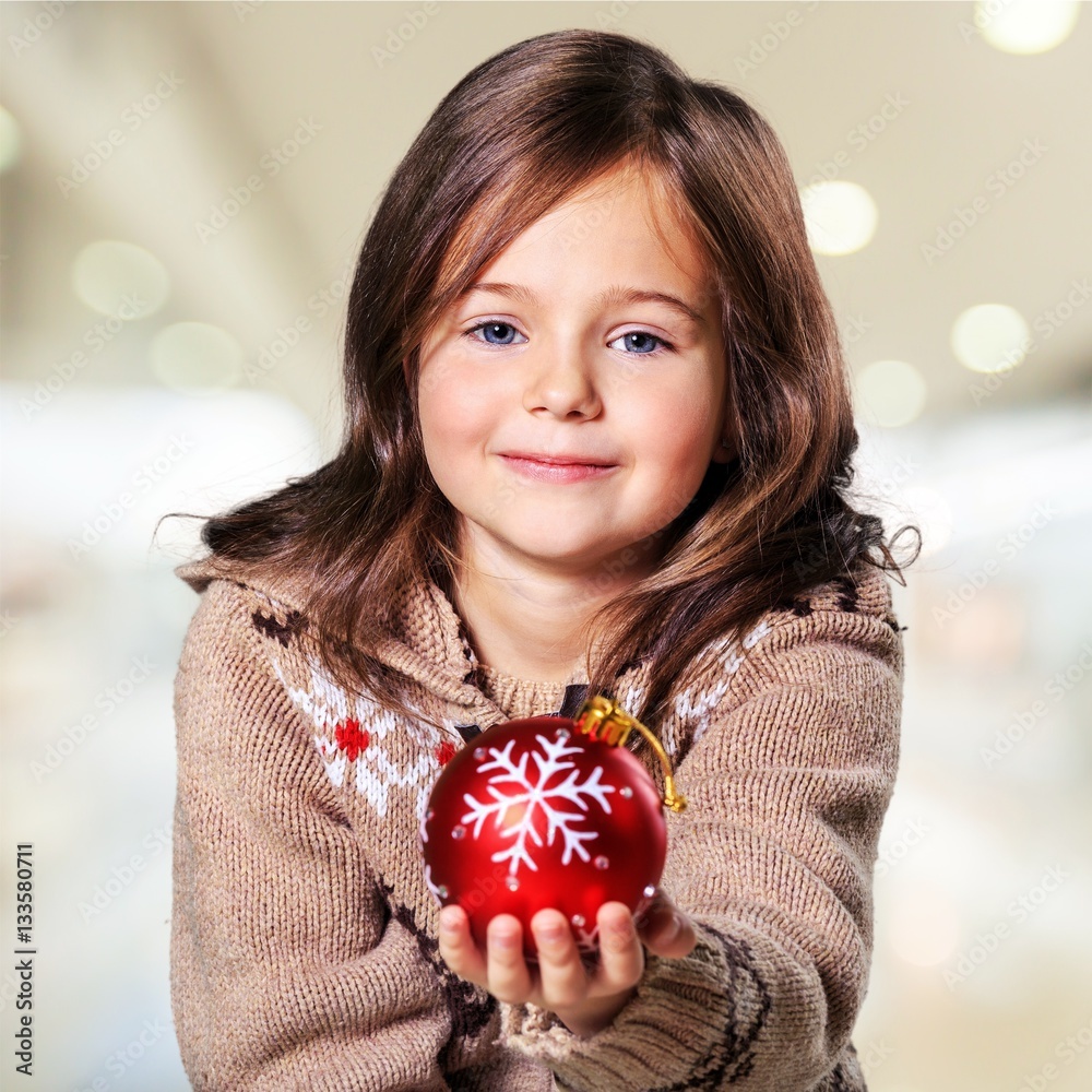 Child giving a christmas present.