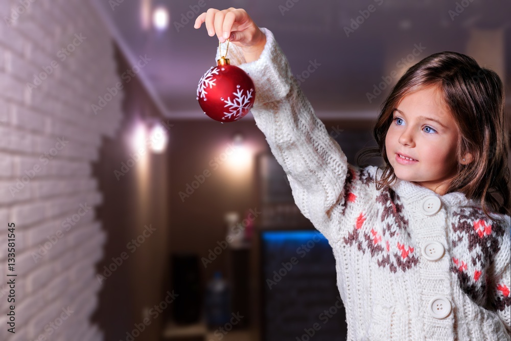 Little girl decorating.