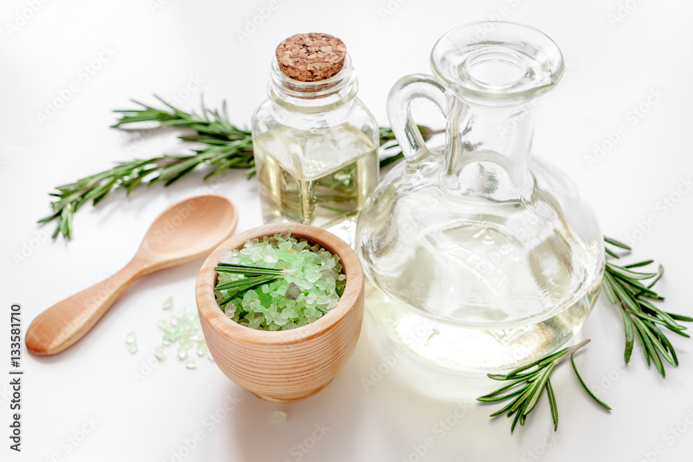 organic cosmetics with extracts of herbs rosemary on white background