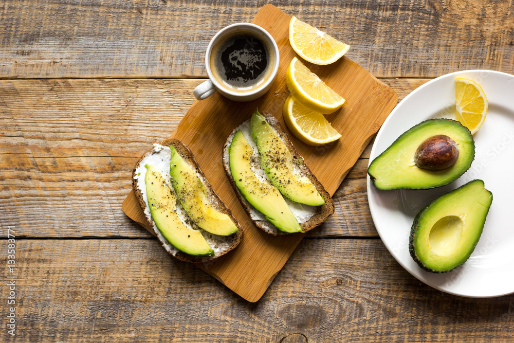 making sandwiches with avocado healthy organic food top view