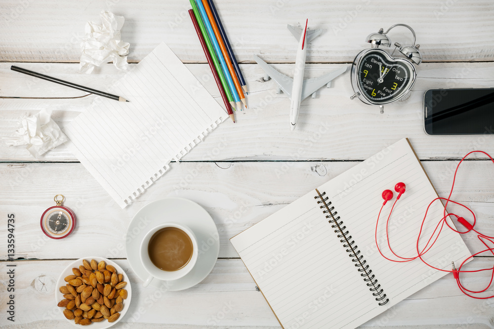 Top view of Blank paper and pencil ,smartphone,coffee,almond