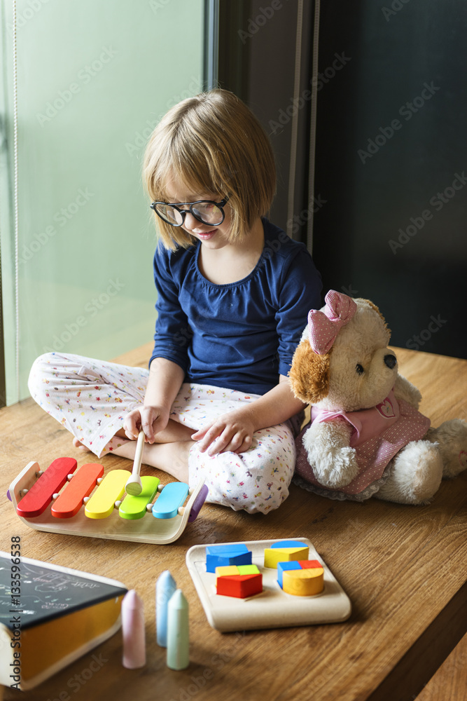 Little Girl Playing Toys Concept