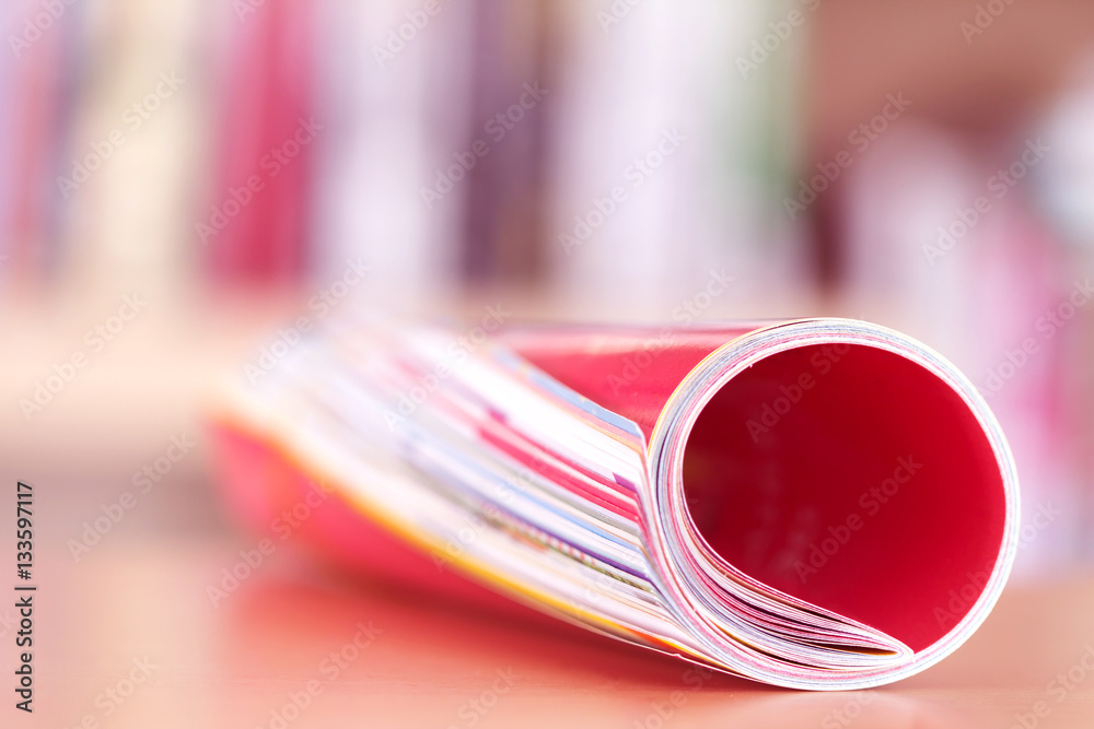 Close up edge of colorful magazine stacking roll 