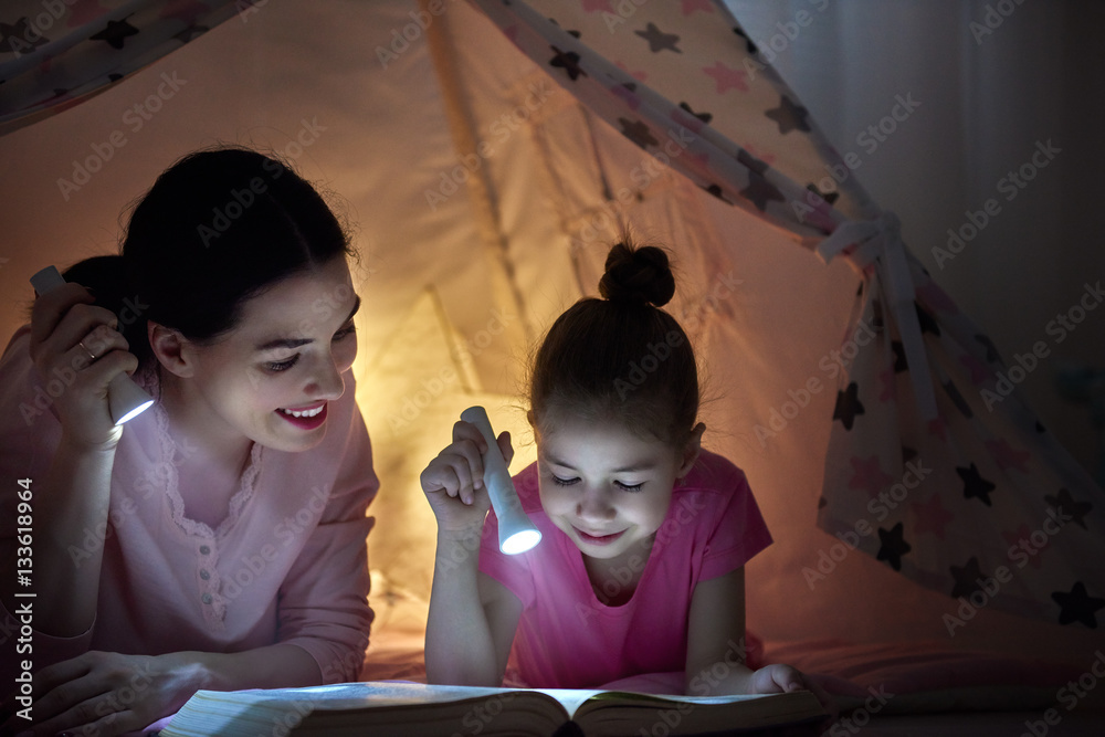 Mom and child are reading book