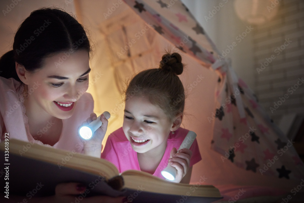 Mom and child are reading book