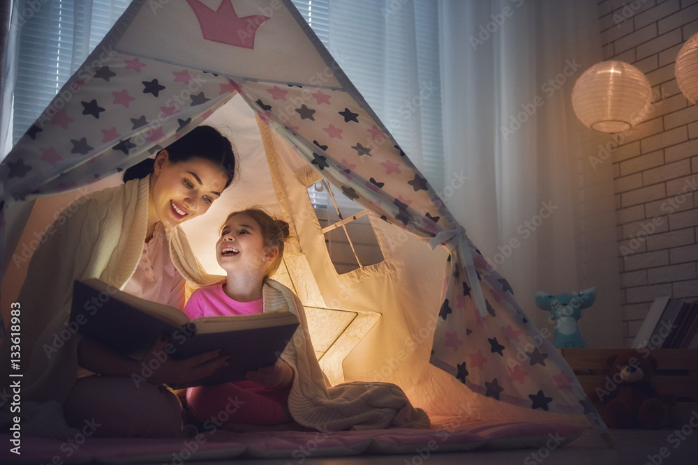 Mom and child are reading book