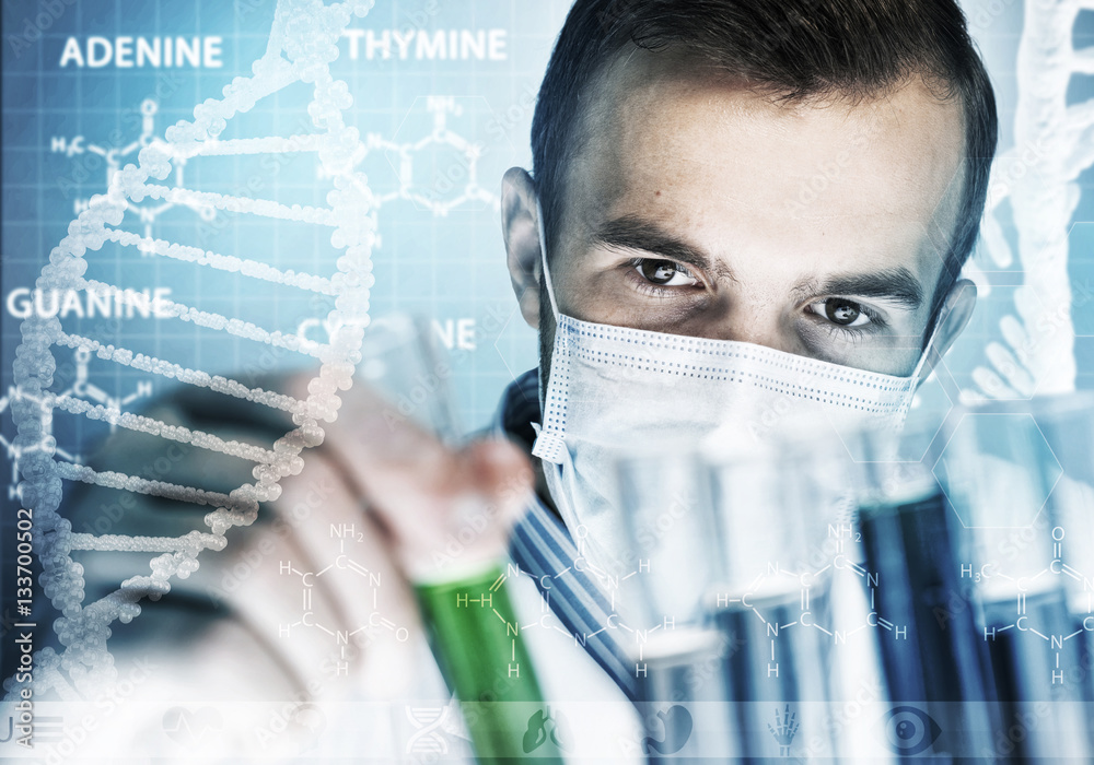 Young scientist mixing reagents in glass flask in clinical laboratory