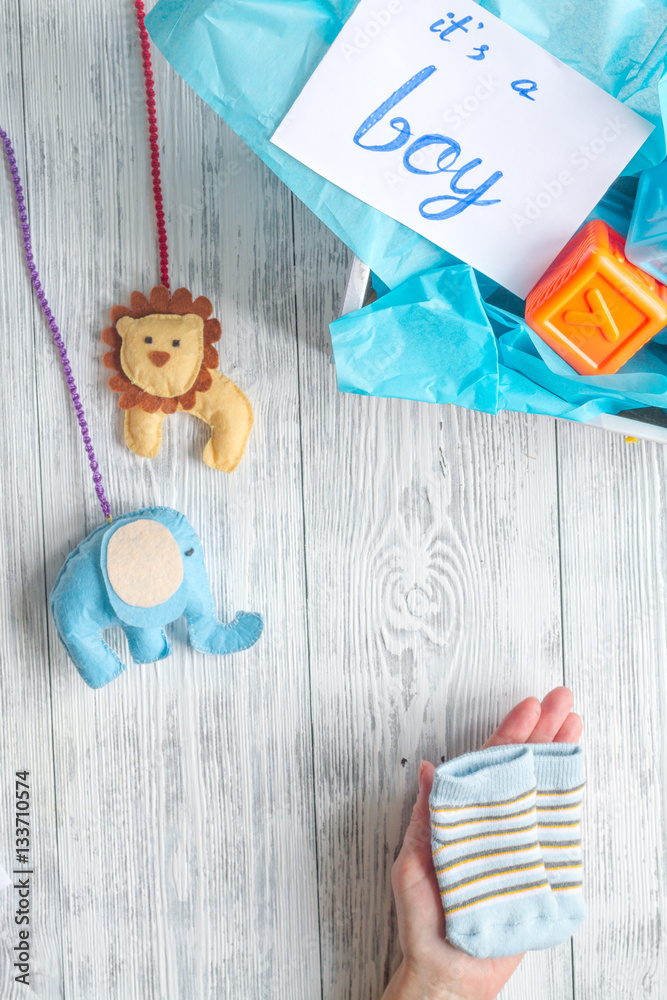 birth of boy - baby shower concept on wooden background