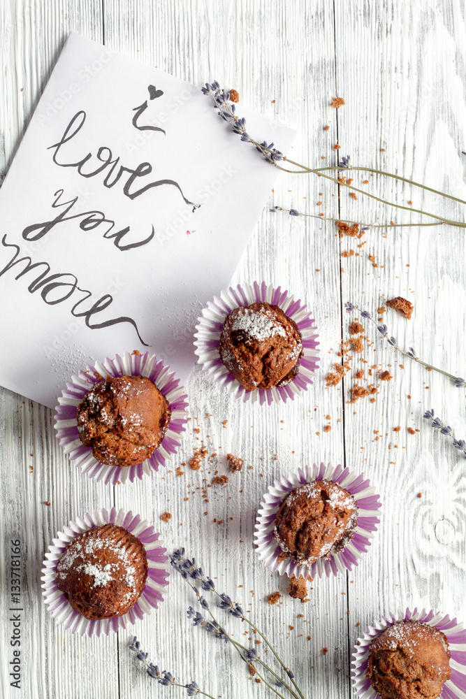 concept of Valentines Day cupcakes wooden background top view